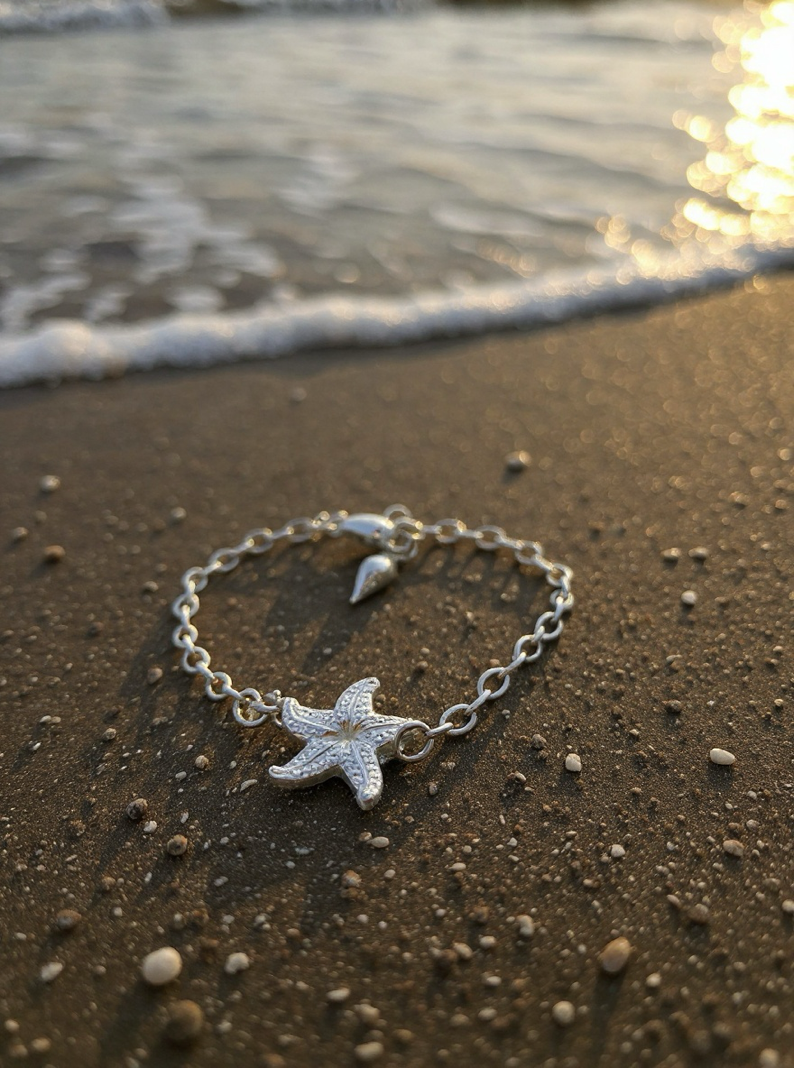 Silver bracelet with starfish charm on a beach