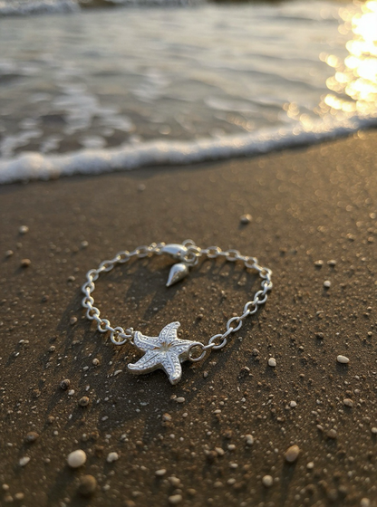 Silver bracelet with starfish charm on a beach